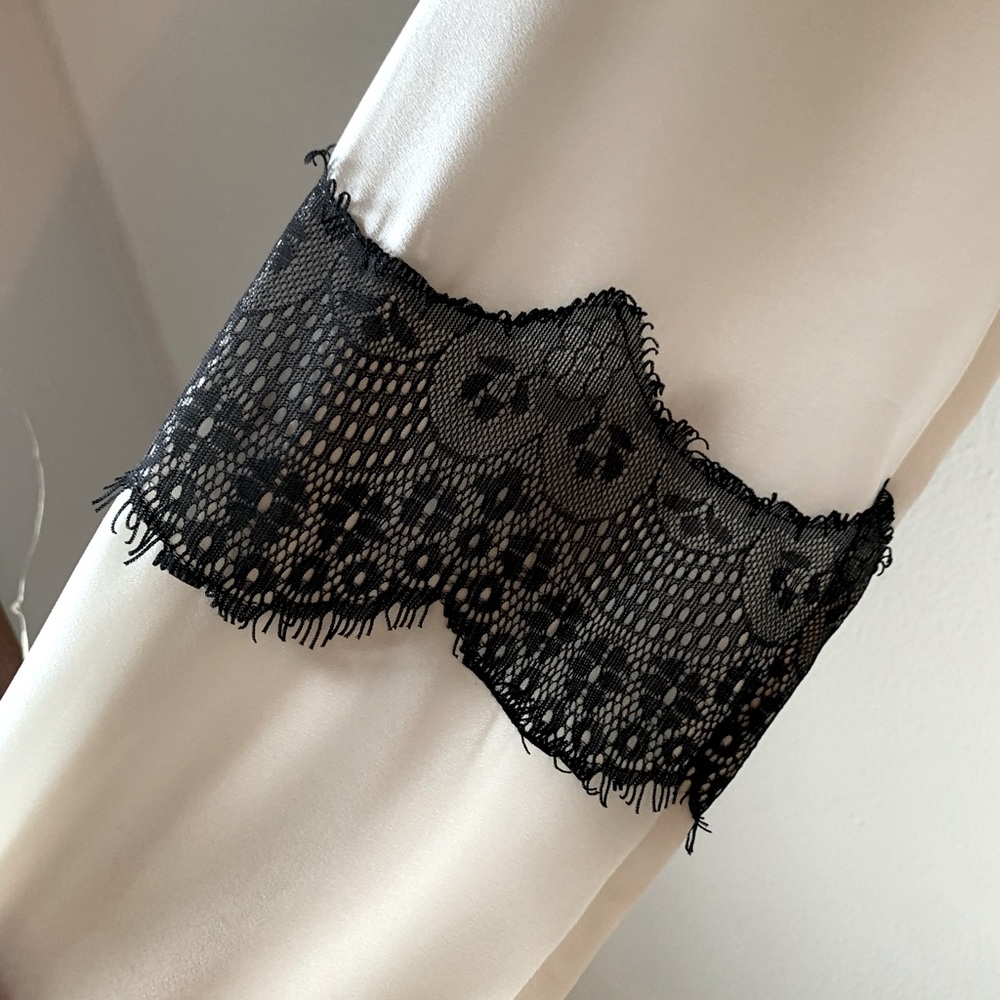 Mossimo White Blouse with Black Lace detailing.
